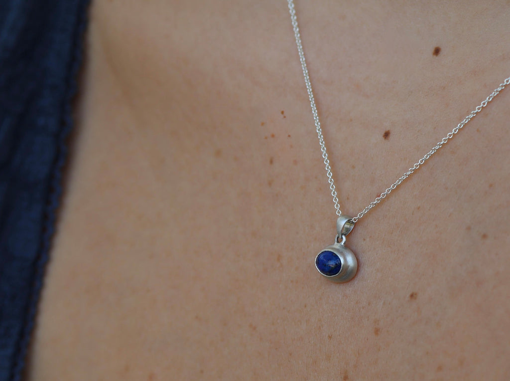 Lapis lazuli sterling silver pendant worn on neck