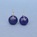 Handcrafted sterling silver drop earrings featuring natural lapis beads.