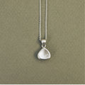 Handcrafted sterling silver triangle memory tag pendant with a natural diamond.